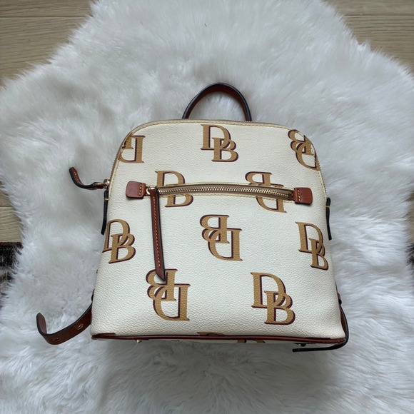 Dooney & Bourke Handbags - Dooney & Bourke Monogram Cream Tan Leather Trim Gold hardware Backpack Bag